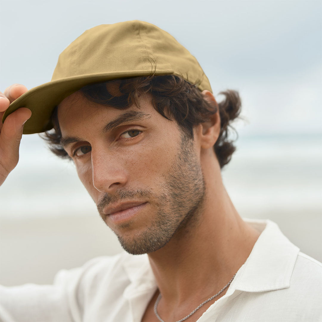 Model wearing Kerrin Chino Six Panel Ball Cap, side profile showcasing the fit and silhouette