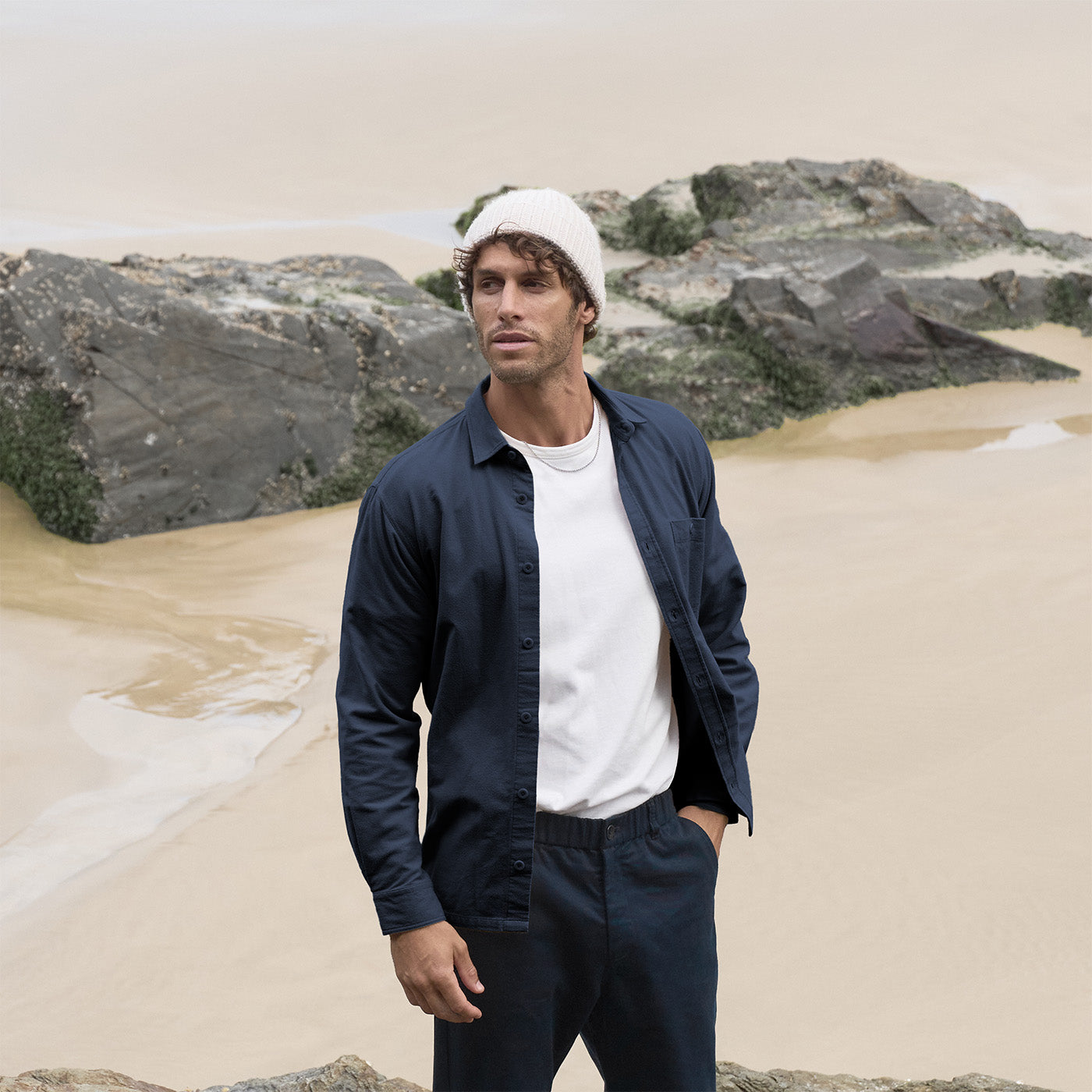 Model wearing Kerrin navy flannel shirt in outdoors setting, front view cropped to show relaxed fit. Made from 100% Japanese cotton fabric with straight hem detail.