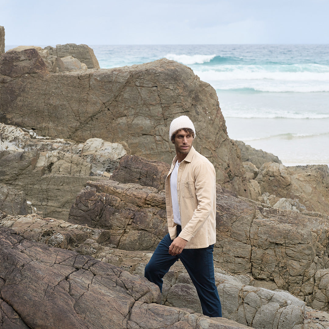 Kerrin flannel shirt styled in natural outdoor setting, showcasing its versatility as both a standalone piece and layering option. Australian-designed with Japanese cotton for durability and comfort
