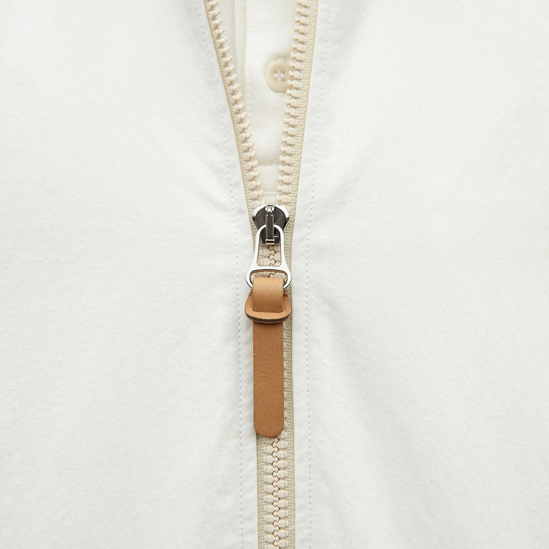 Custom zip detail with leather puller on Kerrin Breezebreaker jacket in white